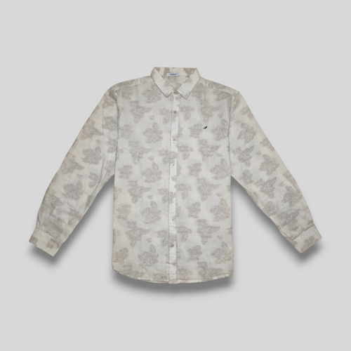 A beige linen shirt with embossed flower pattern, displayed against a neutral background