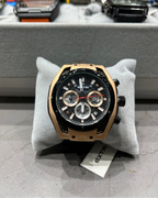 Luxury watch on a gray stand with 'Extr' tag in a store setting