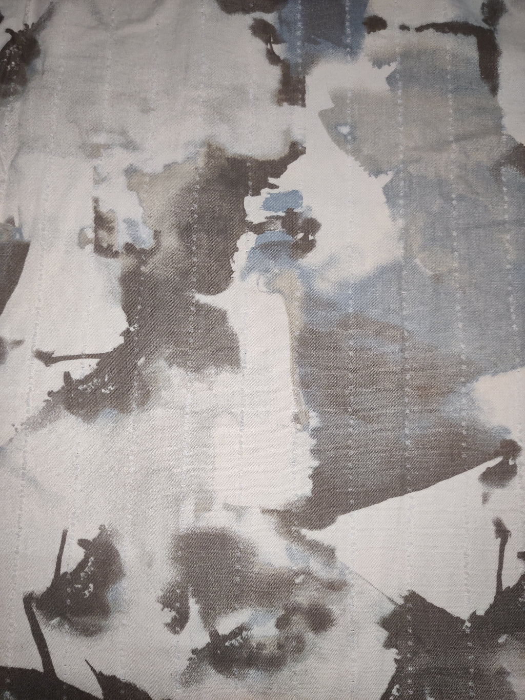 Abstract art with brown, beige, and gray colors on a textured surface