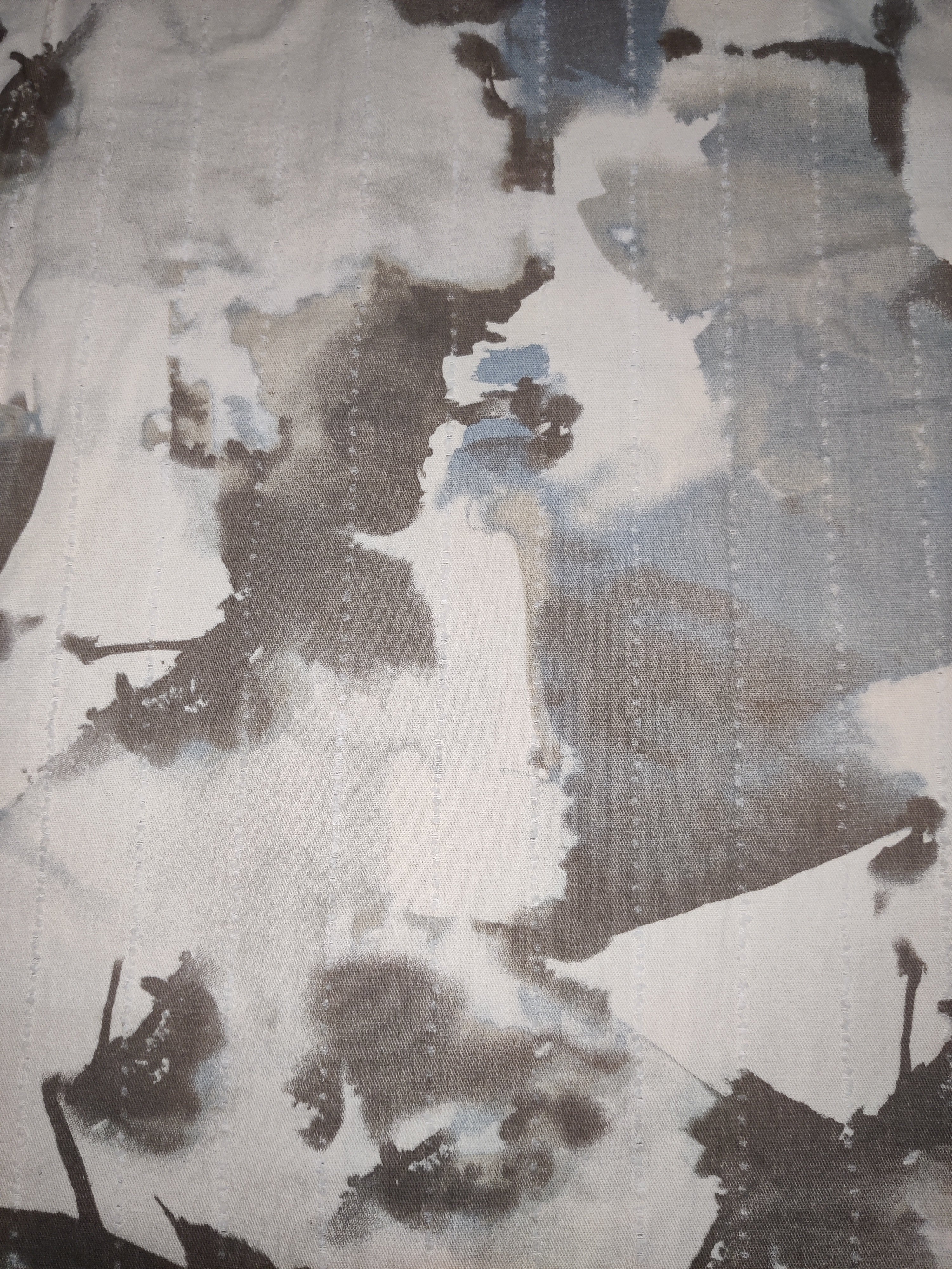 Abstract art with brown, beige, and gray colors on a textured surface