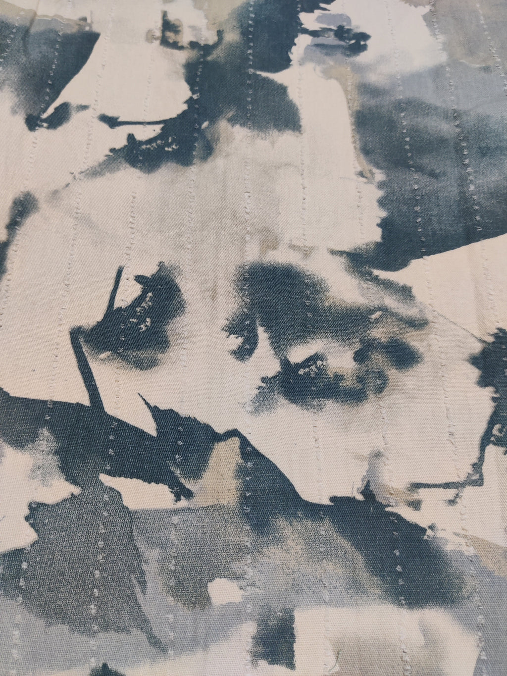Abstract art with black and white brush strokes on a textured surface