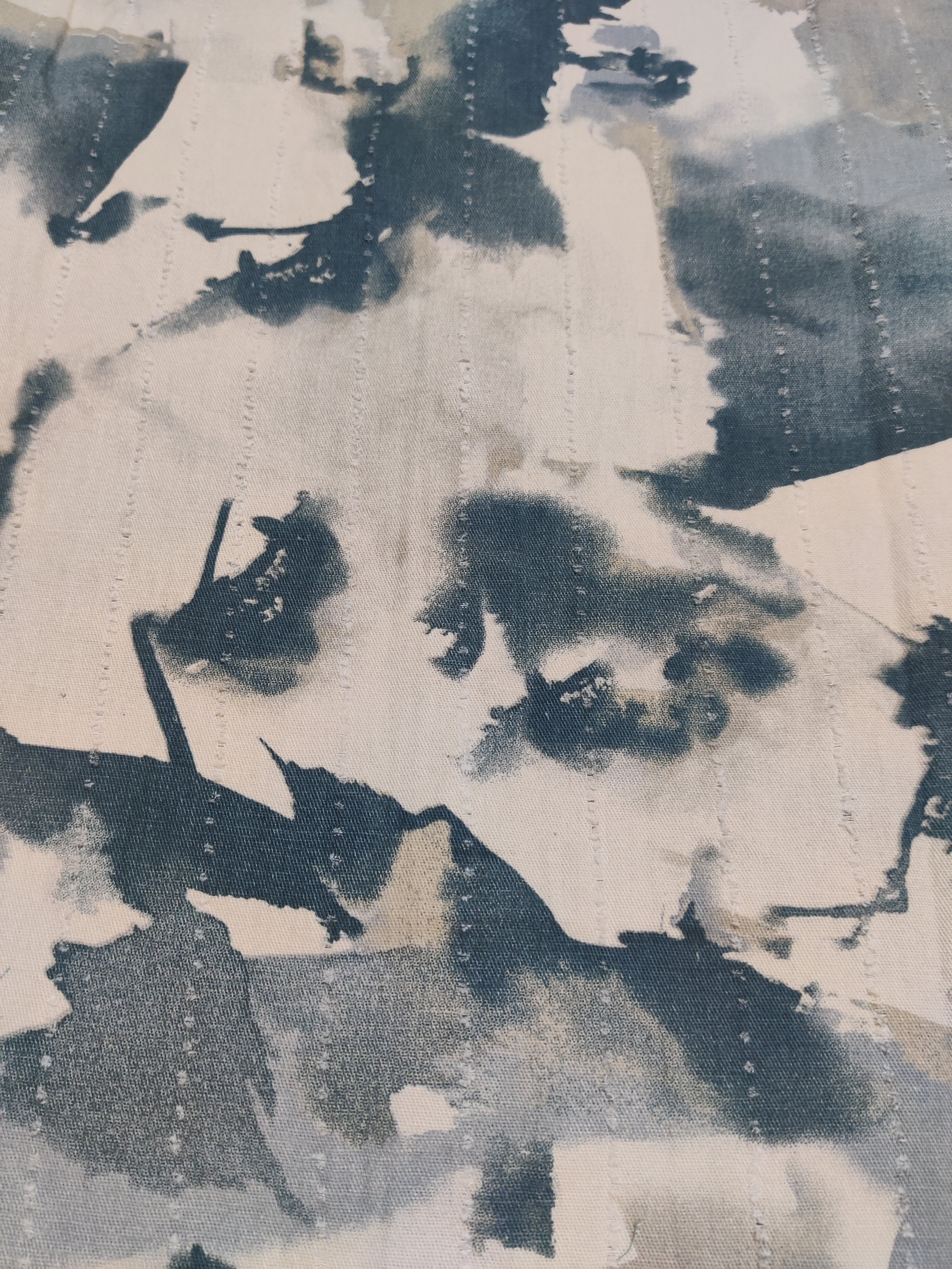 Abstract art with black and white brush strokes on a textured surface