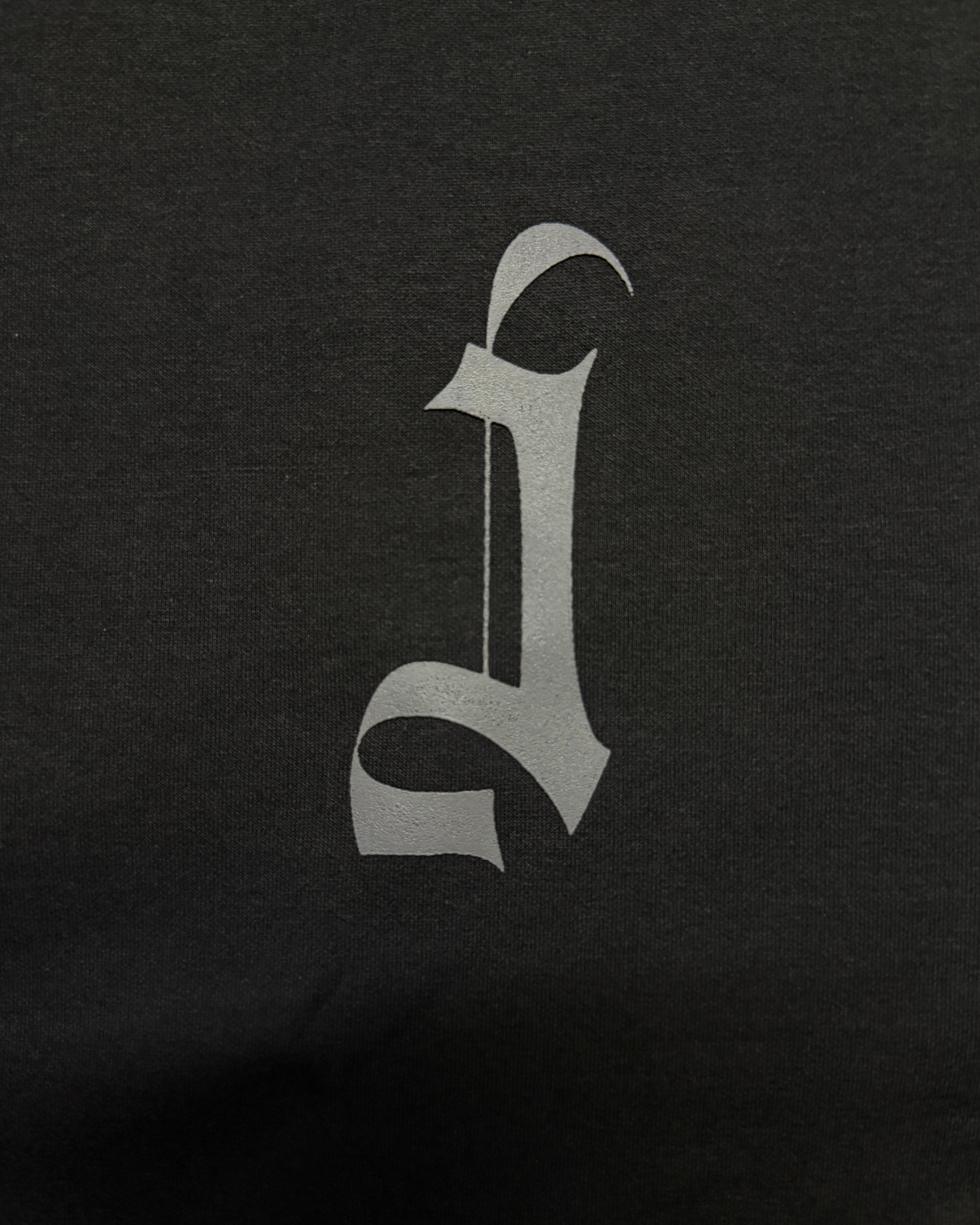 Grey HD Printed Decorative Gothic letter 'J' in a stylized font on a black background