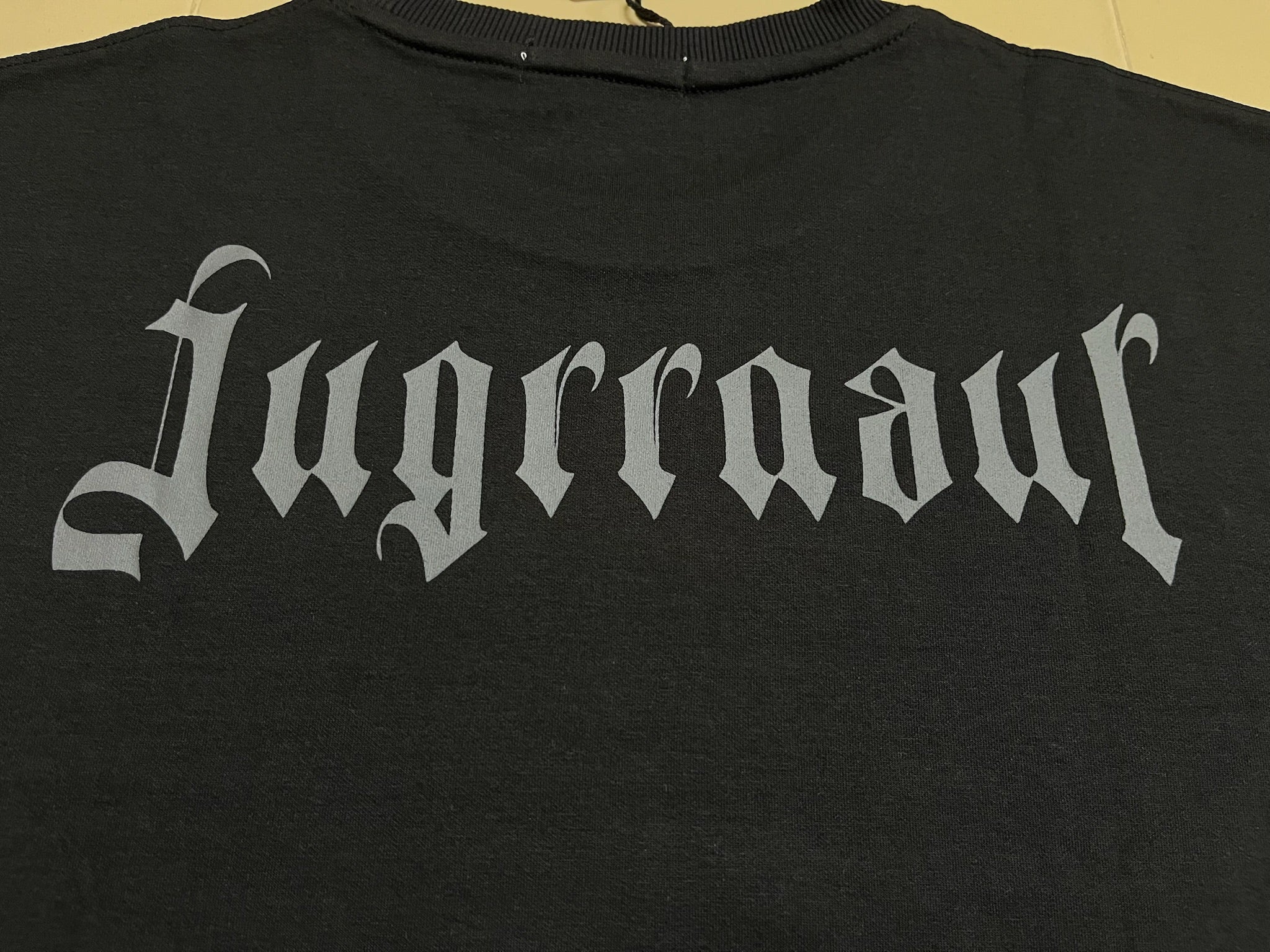 Black shirt with 'Jugrrnaut' text in a stylized gothic font on a plain background