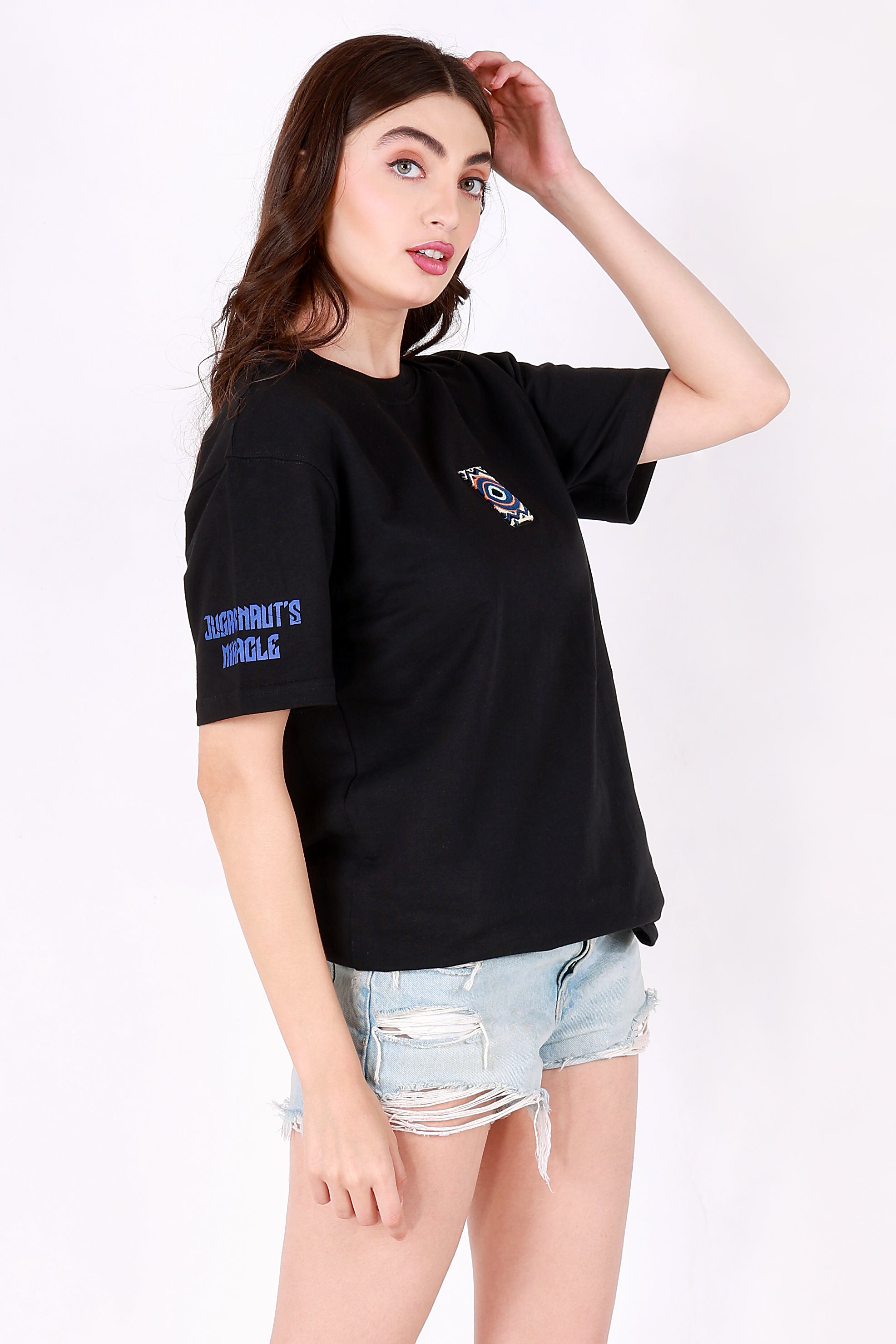 Woman wearing a black t-shirt with text and graphics on a white background