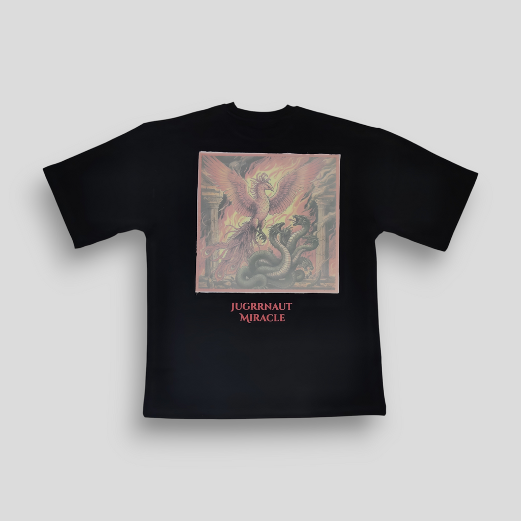Black t-shirt with a colorful graphic and 'Jugrnaut Miracle' text on a light gray background