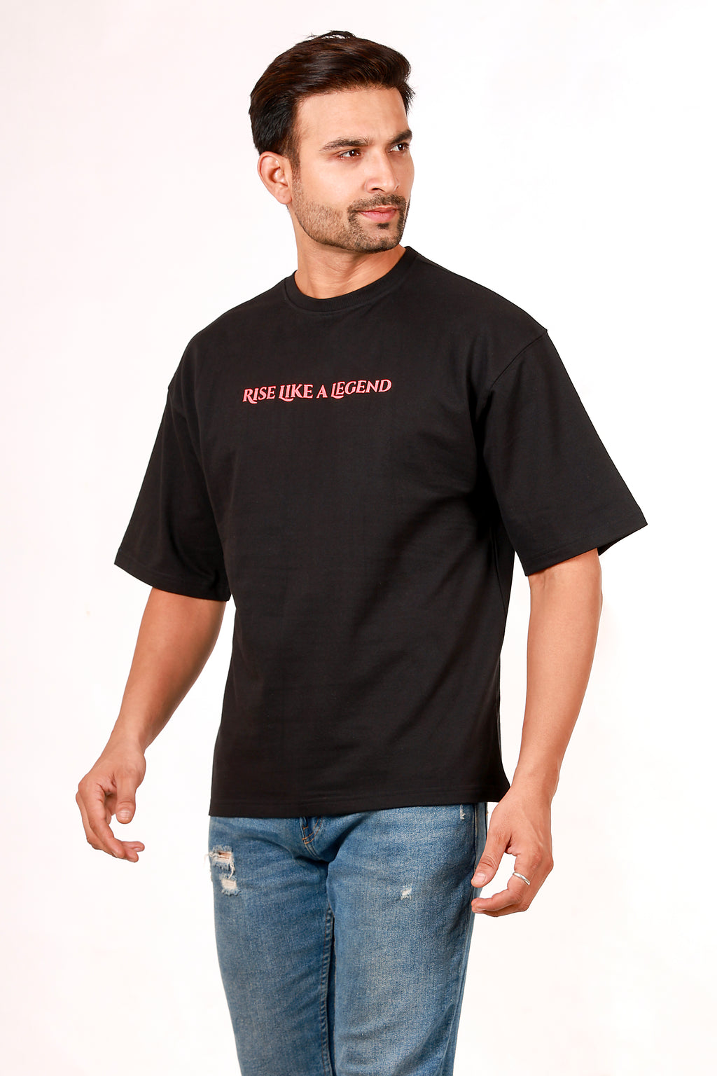 Man wearing a black t-shirt with 'Rise Like A Legend' text on a white background