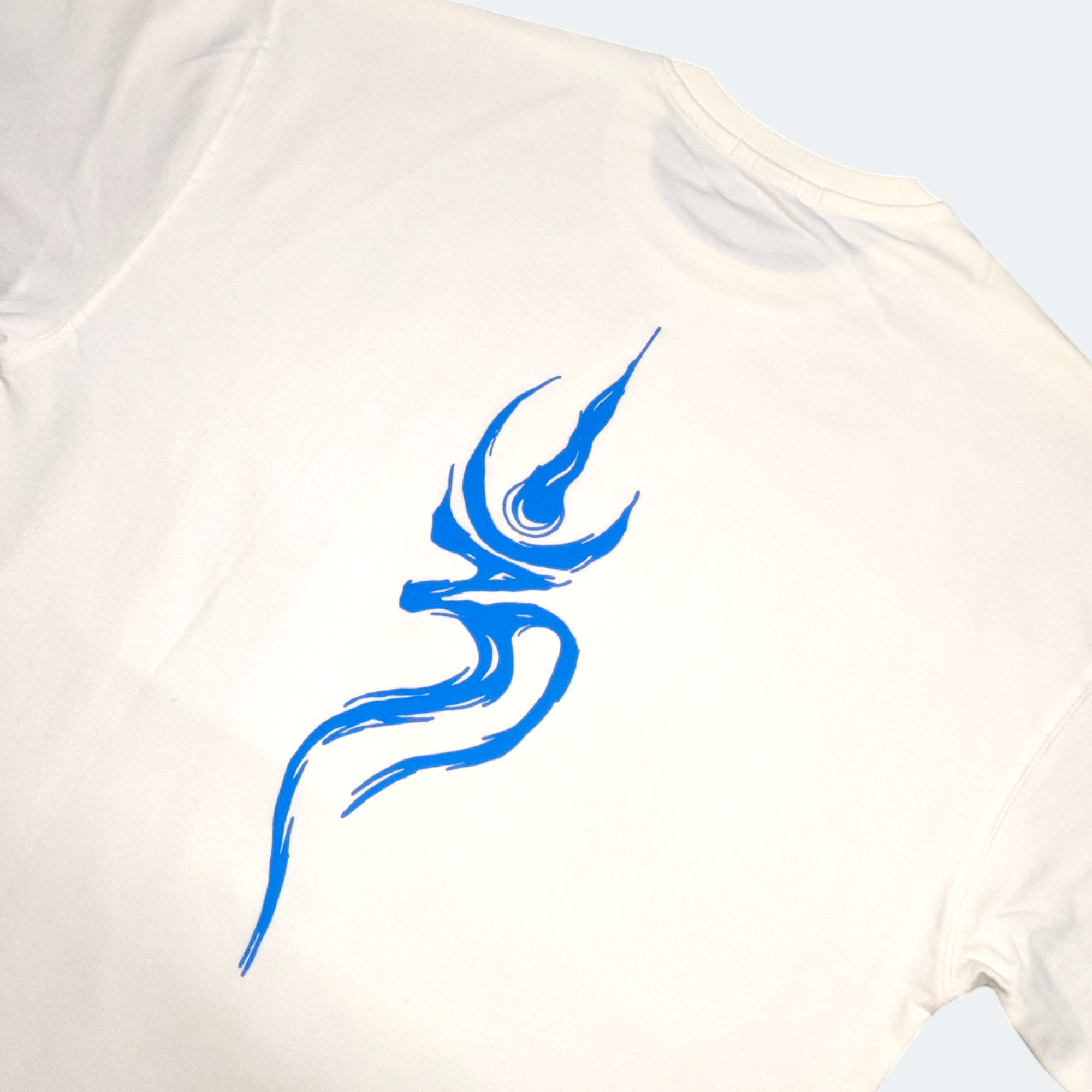 White shirt with a blue abstract design on a light gray background