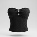 Black strapless top with heart-shaped buttons on a gray background