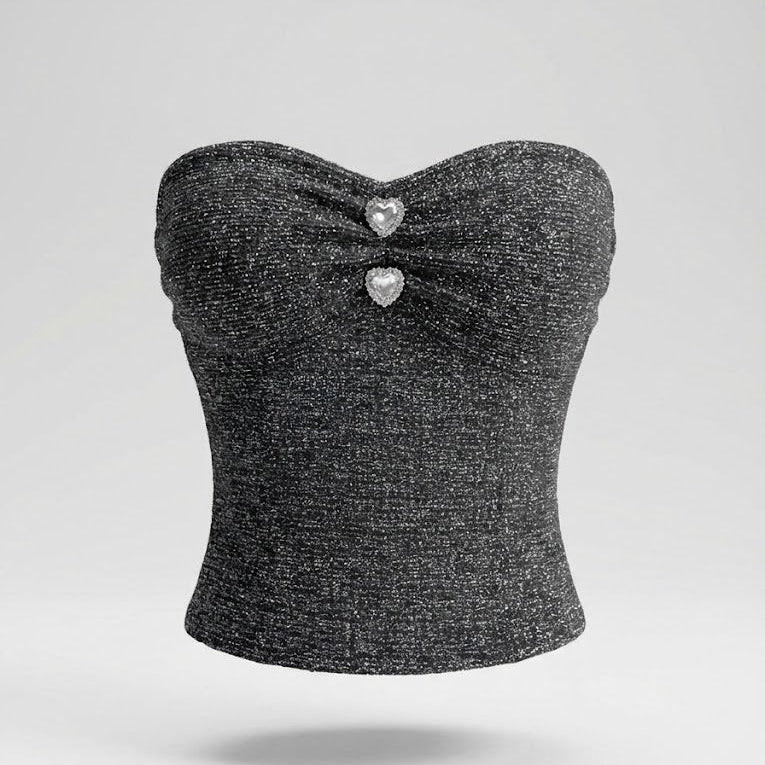 Black strapless top with heart-shaped embellishments on a light gray background