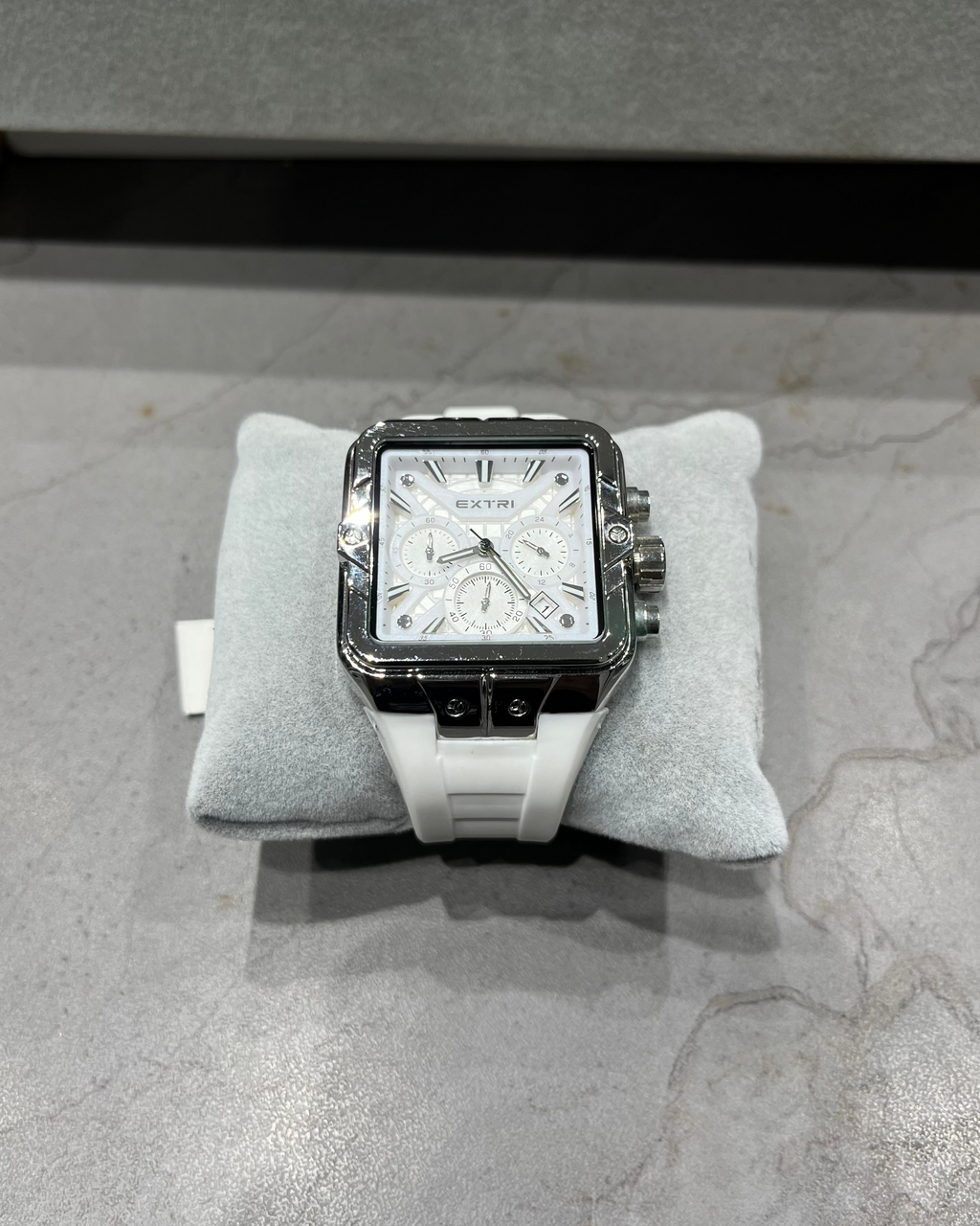 Watch on a gray cushion with a gray background
