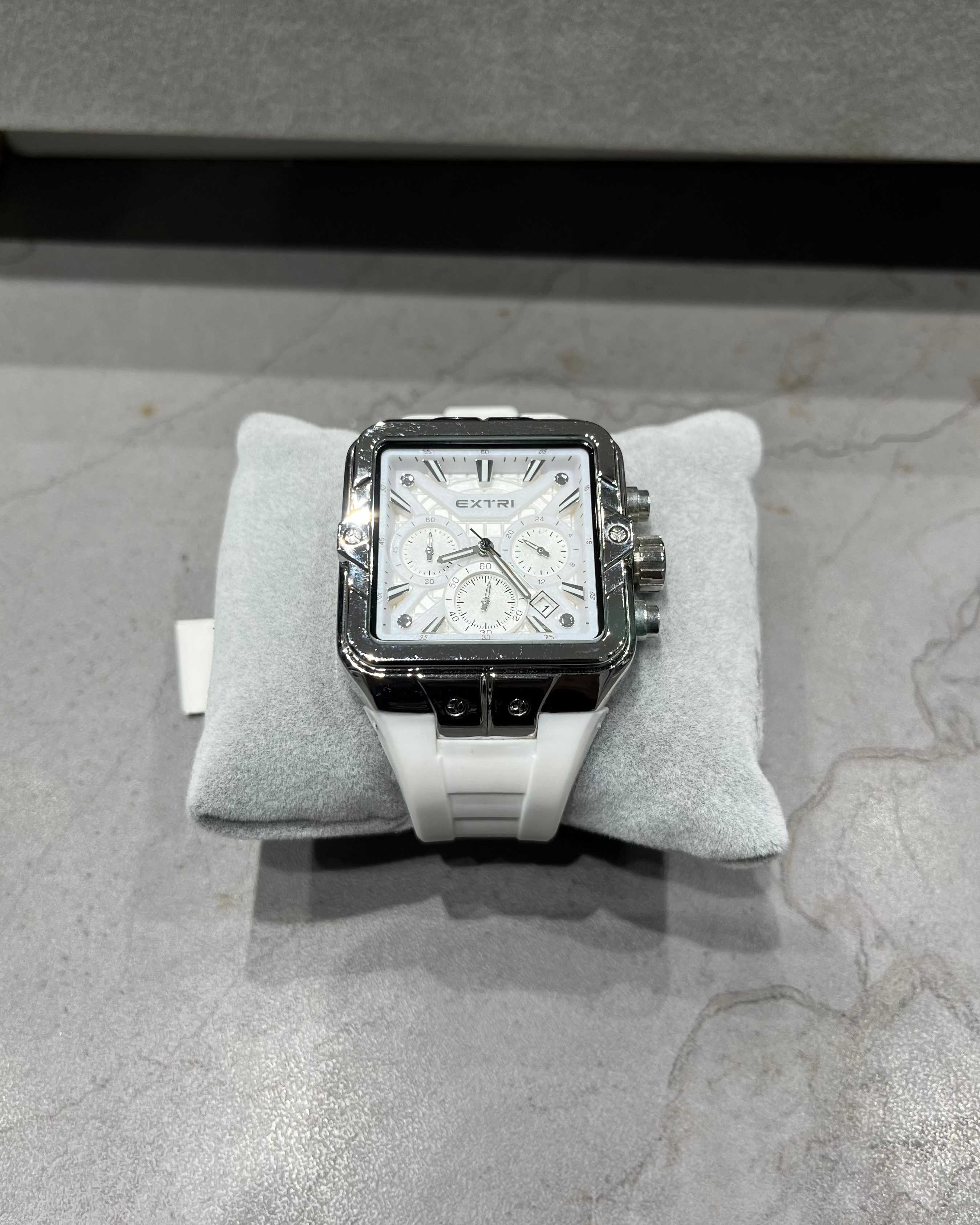 Watch on a gray cushion with a gray background