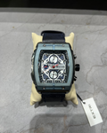 Luxury watch with a detailed face on a gray surface, featuring the brand 'Extri'.