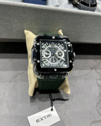 Luxury watch with intricate design on a gray surface, brand 'EXTRI' visible