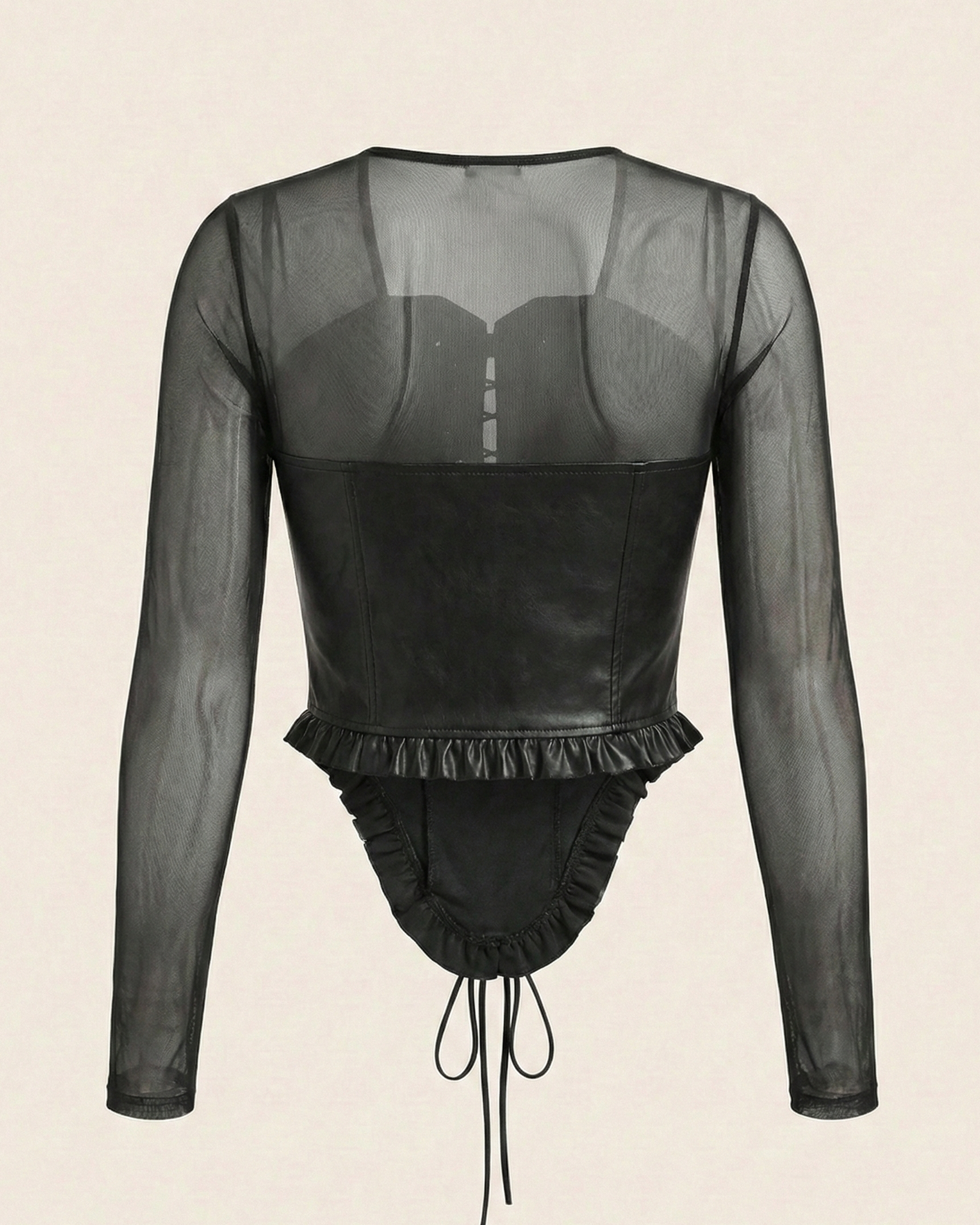 Black sheer long-sleeve top with ruffled details on a beige background