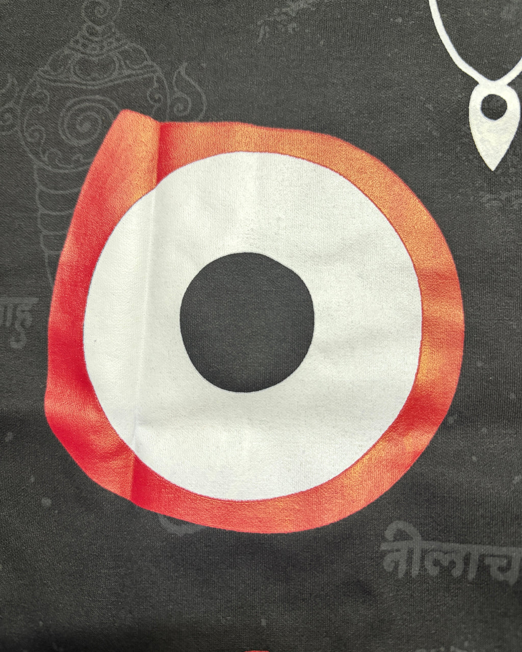 Circular eye of jagannath design with red and white colors on a dark black background