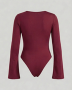 Maroon bodysuit with long sleeves on a light gray background