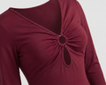 Maroon long-sleeve top with a decorative feature on a white background