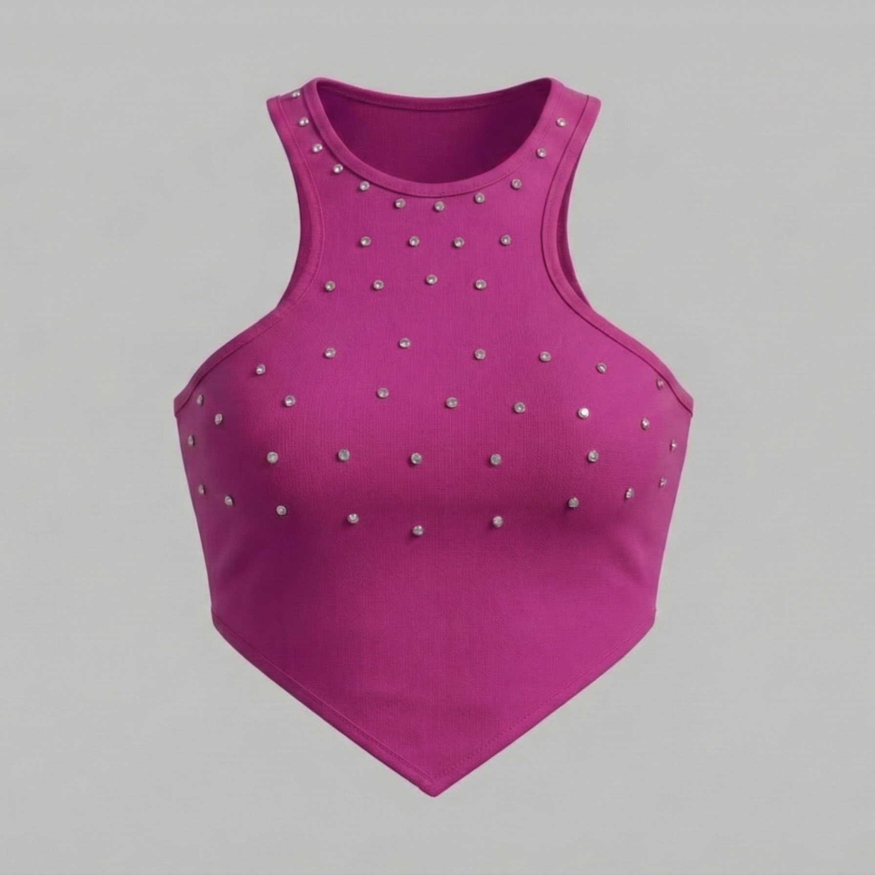 Pink crop top with silver studs on a gray background