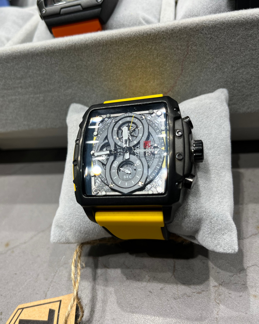 Watch with a transparent face on a gray surface