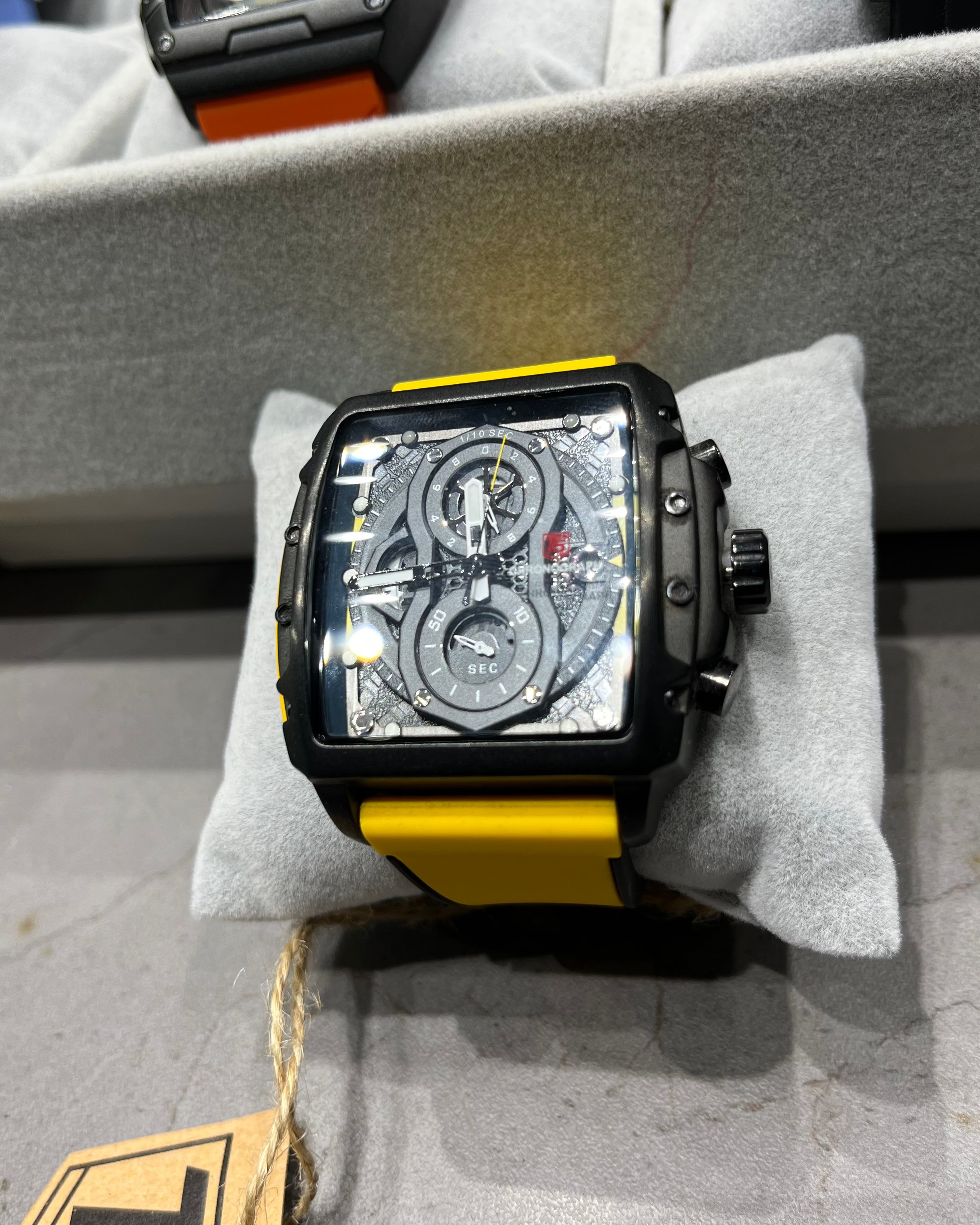 Watch with a transparent face on a gray surface