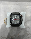 Black wristwatch with multiple dials on a gray marble surface