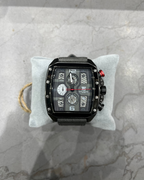 Black wristwatch with multiple dials on a gray marble surface