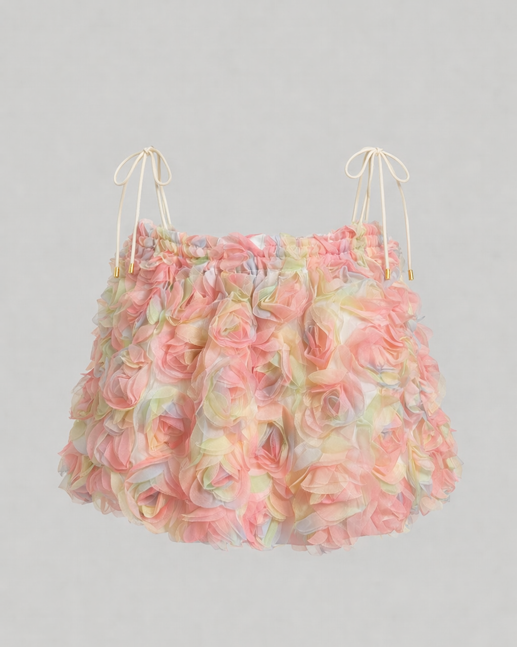 Floral top with ruffled details on a gray background