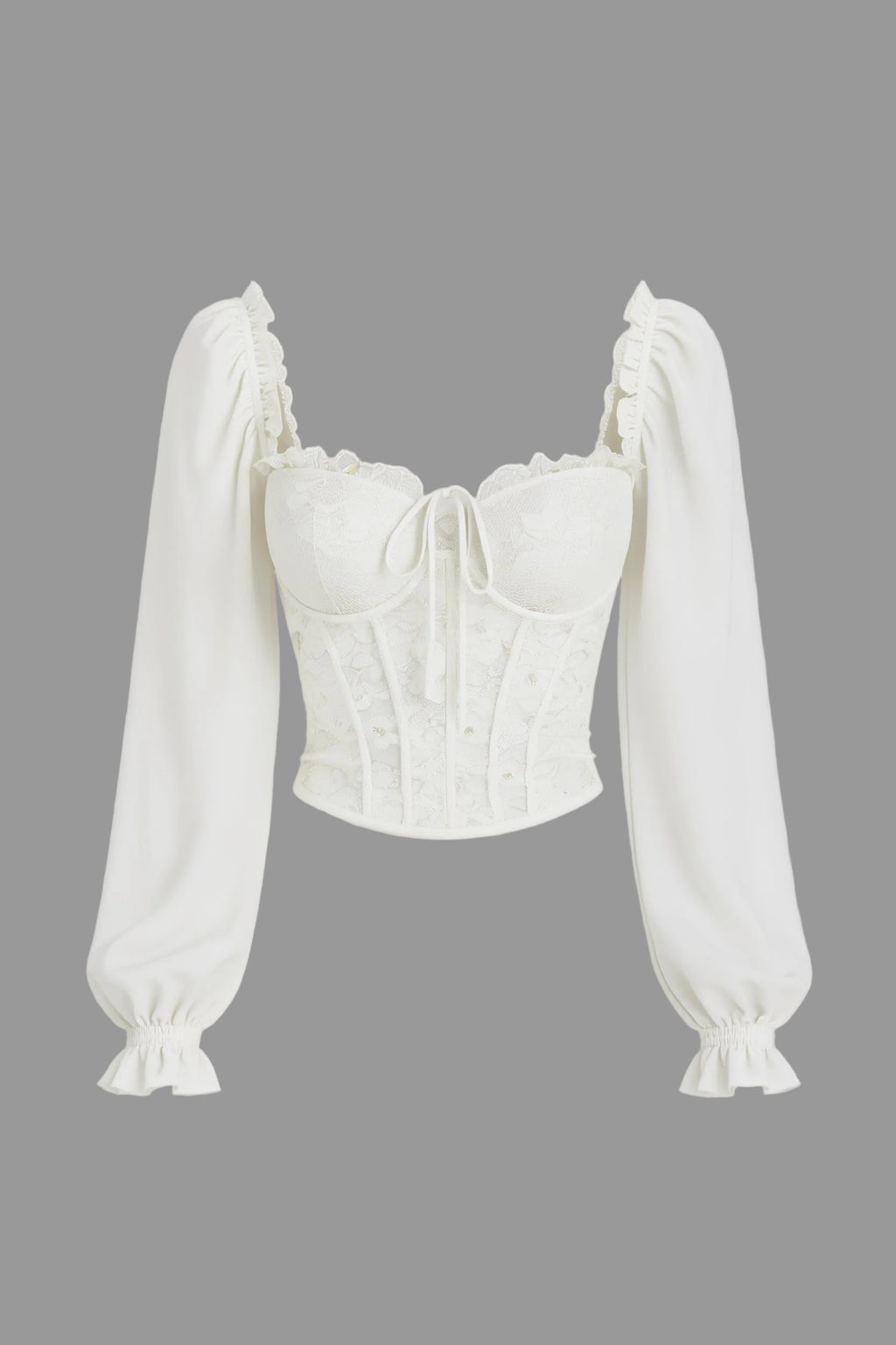 White blouse with long sleeves on a light gray background